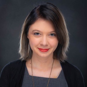 Portrait of woman smiling at camera.