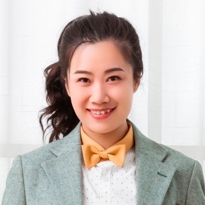 Portrait of woman smiling at camera.