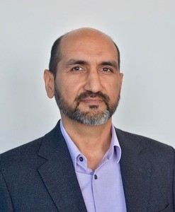 Portrait of smiling man in business suit.