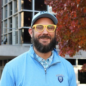 Smiling man on campus.