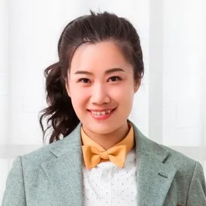 Portrait of woman smiling at camera.